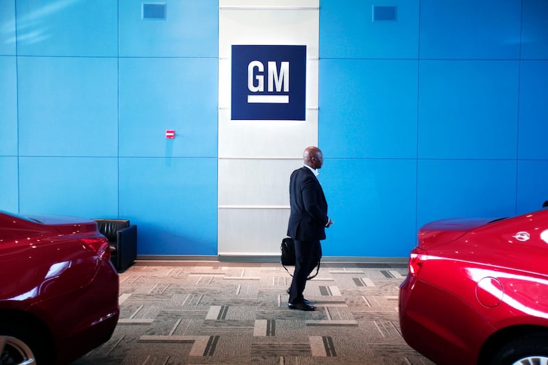 (FILES) In this file photo a man walks past the GM logo at the General Motors Technical Center on June 5, 2014 in Warren, Michigan.  US auto safety authorities said on November 23, 2020 that they had ordered General Motors to recall nearly six million pickup trucks and sport utility vehicles that contain Takata airbags. The National Highway Traffic Safety Administration rejected a four-year old appeal from GM and concluded the automaker "has not met its burden of establishing that the defect is inconsequential to motor vehicle safety," according to an agency statement. / AFP / GETTY IMAGES NORTH AMERICA / BILL PUGLIANO

