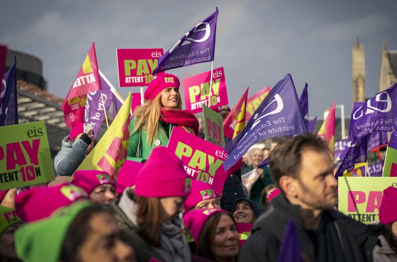 Members of the Educational Institute of Scotland teaching union join a rally outside the Scottish Parliament in Edinburgh. PA