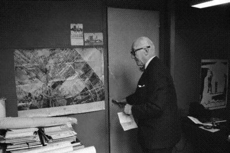 Le Corbusier in his office in Paris, with his plan of Baghdad Town on the wall. Rene Burri / Magnum Photos