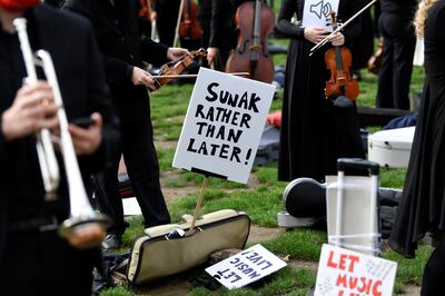 Musicians perform near the houses of Parliament during a protest highlighting their inability to perform live or work during the coronavirus disease (COVID-19) pandemic, London, Britain, October 6, 2020. REUTERS/Toby Melville
