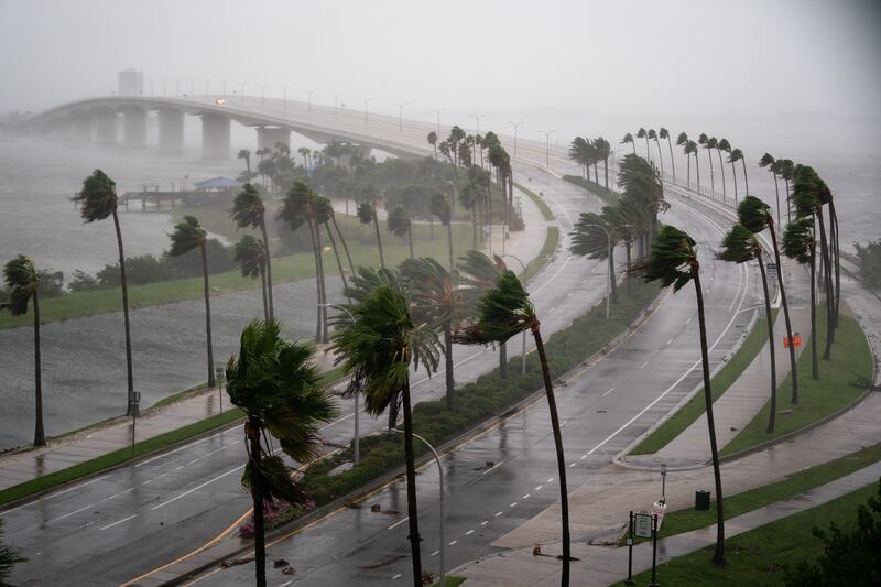 Wind blasts across Sarasota Bay as Hurricane Ian churns to the south in Florida. The storm made US landfall at Cayo Costa with wind speeds of more than 225 kilometres per hour. AFP