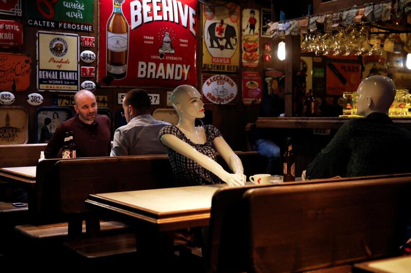 Mannequins are seen placed between tables to make customers sit according to social-distancing rules in a bar that reopened after being closed for weeks, amid the spread of the coronavirus, in Istanbul, Turkey. Reuters