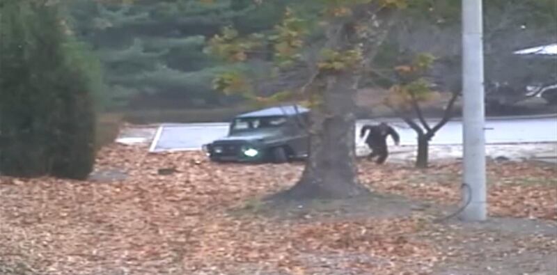 epa06343199 A handout screengrab of a surveillance video taken on 13 November 2017 and released by the United Nations Command (UNC) on 22 November 2017 shows a North Korean Korean People's Army (KPA) defector running out from a jeep at the Joint Security Area (JSA) of the Korean Demilitarized Zone (DMZ). According to the UNC, a UNC Special Investigation Team conducted an investigation into the footage saying that the KPA violated the UN Armistice Agreement twice during the event by 'firing weapons across the Military Demarcation Line (MDL) and when the defecting soldier actually temporarily crossed the MDL' to reach the Joint Security Area (JSA) in the village of Panmunjom on 13 November 2017.  EPA/UNITED NATIONS COMMAND HANDOUT -- BEST QUALITY AVAILABLE -- HANDOUT EDITORIAL USE ONLY/NO SALES