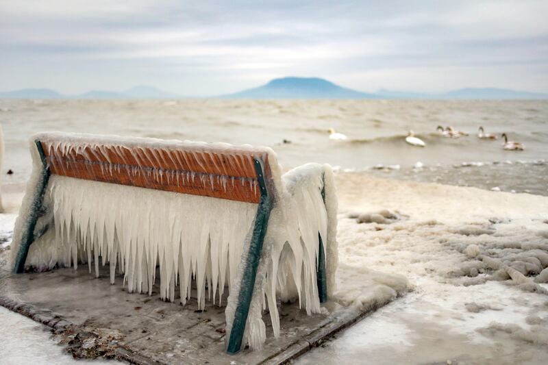A bench is entombed in ice on the shore of Lake Balaton in Balatonfenyves, Hungary, as the temperature plunges to minus 6°C. EPA
