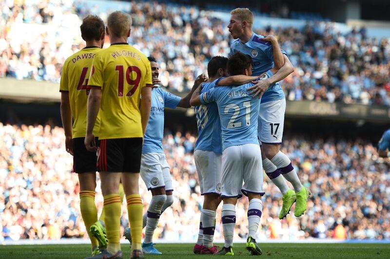 Manchester City's Portuguese midfielder Bernardo Silva celebrates with teammates after he scores the team's seventh goal. EPA