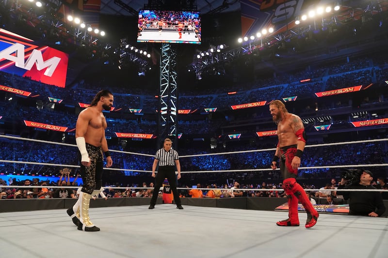 Seth Rollins and Edge face off in a match at SummerSlam. Photo: WWE