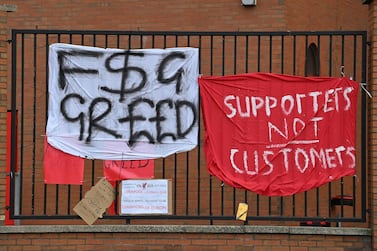 Banners critical of the European Super League project hang from the railings of Anfield stadium, home of Liverpool. AFP