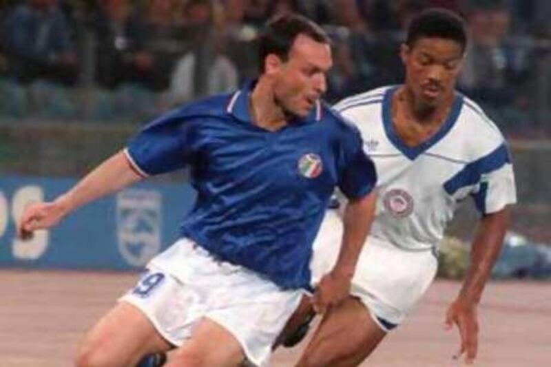 Salvatore Schillaci beats Jimmy Banks, of the US, to the ball during the 1990 World Cup in Italy.
