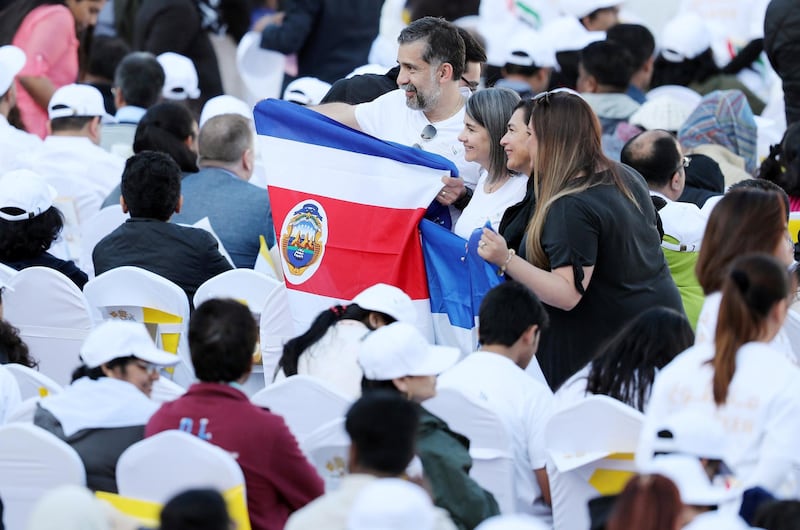 Abu Dhabi, United Arab Emirates - February 05, 2019: People get ready for the mass. Pope Francis takes a large public mass to mark his land mark visit to the UAE. Tuesday the 5th of February 2019 at Zayed Sports city stadium, Abu Dhabi. Chris Whiteoak / The National