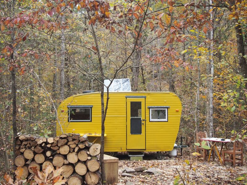 Camp Grits solar yellow camper in Cosby, Tennessee, US