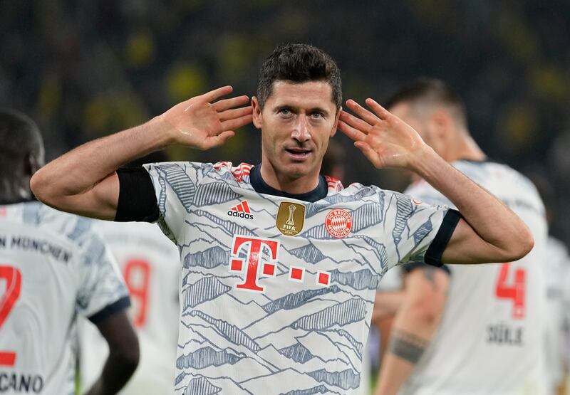 Robert Lewandowski celebrates after scoring Bayern's third goal - and his second - against former club Dortmund.