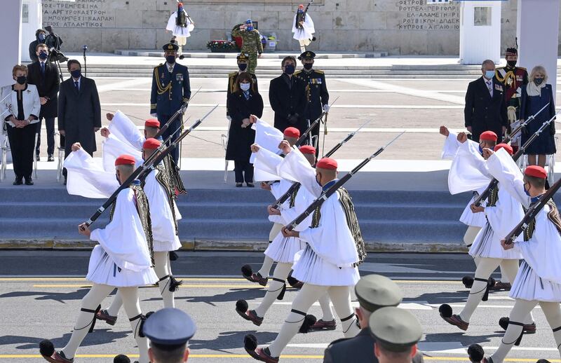 Cypriot President Nicos Anastasiades and his wife Andri Anastasiades, Greek President Katerina Sakellaropoulou, Prince Charles, and Camilla  attend a Independence Day Military Parade at Syntagma Square. AFP