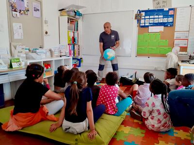 Fernando Reis of the Sharks Educational Institute talks to children in Lisbon about the ocean. He says children should be educated about the importance of sharks to our planet's ecosystem. Photo: Fernando Reis
