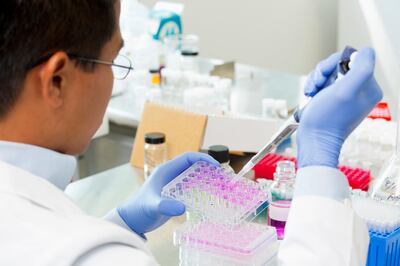 Pacific Islander scientist working in lab