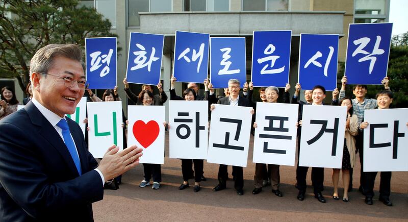 South Korean President Moon Jae-in applauds in Seoul before departing for the truce village of Panmunjom inside the demilitarized zone separating the two Koreas, South Korea. Korea Summit Press Pool / Pool via Reuters