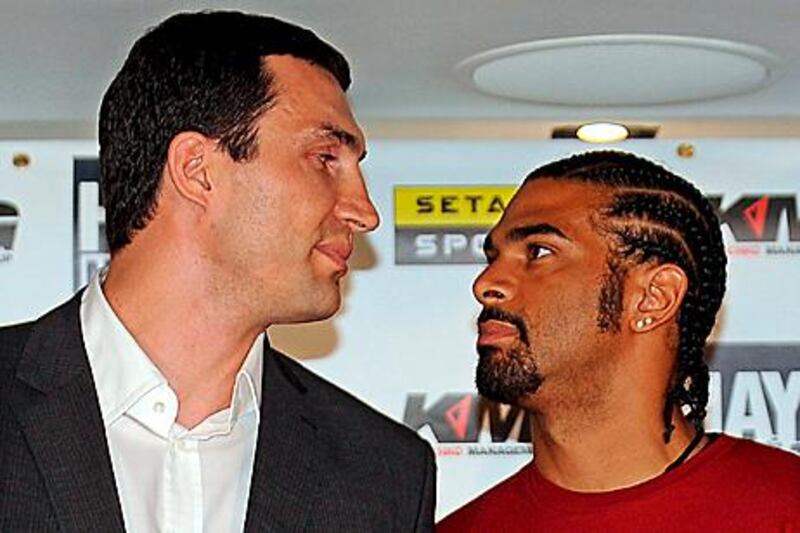 Wladimir Klitschko, left, of Ukraine, and David Haye of Great Britain stare each other down during a news conference in London, previewing their title unification fight on July 2 at Hamburg, Germany.