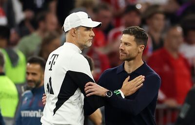 Xabi Alonso, right, the Bayer Leverkusen manager, embraces Bayern Munich coach Thomas Tuchel after their sides played out a 2-2 draw in September. Getty