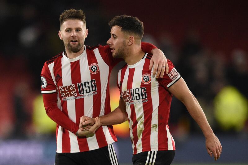 Sheffield United midfielder Oliver Norwood and defender George Baldock celebrate. AFP