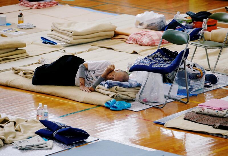 An evacuee takes rest at Okada elementary school that is used as an evacuation centre in Mabi town in Kurashiki, Okayama Prefecture, Japan on July 12, 2018. Reuters