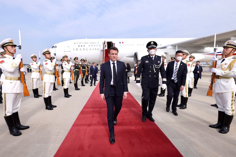 Mr Macron arrives at Beijing Capital International Airport in Beijing. EPA