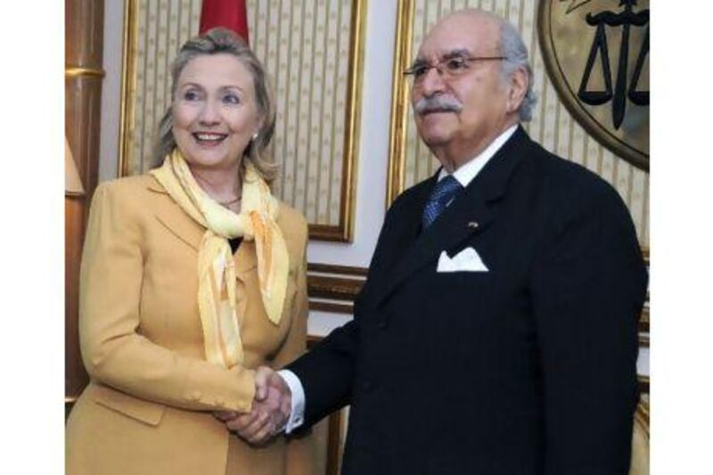 Hillary Clinton, the US secretary of state, with Fouad Embazza, Tunisia's interim president,in Tunis yesterday.