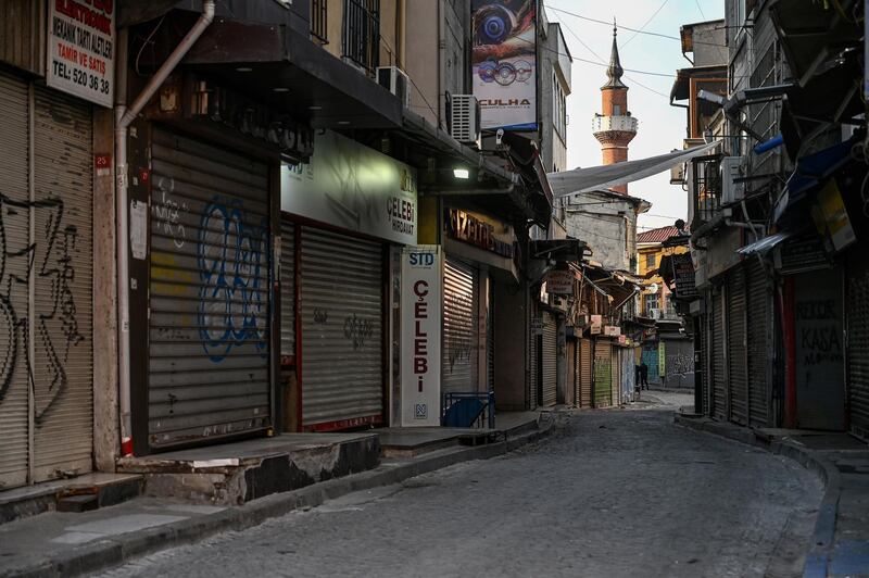 A deserted street with shops closed can be seen near Eminonu square in Istanbul during a week-end curfew aimed at curbing the spread of the Covid-19 pandemic caused by the novel coronavirus.  Under the new restrictions beginning from December 1, a curfew will be imposed on weekdays from 9:00 pm. to 5:00 am. Over the weekend the lockdown will last from 9:00 pm Friday until 5:00 am on Monday.   AFP