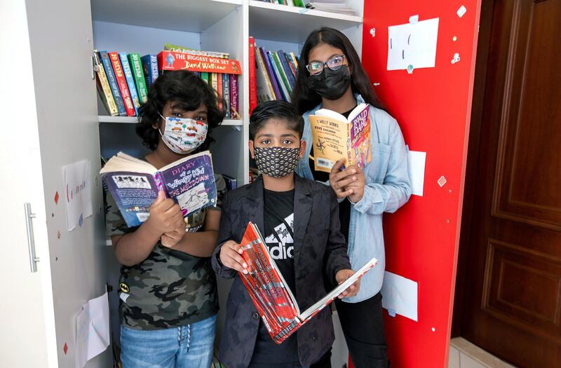 Ayaan Tariq, 7, with friends, Ayesha, 10, and Mohammad, 8, at his library which was once a maids quarters. Victor Besa / The National.
Reporter: Anam Rizi for News