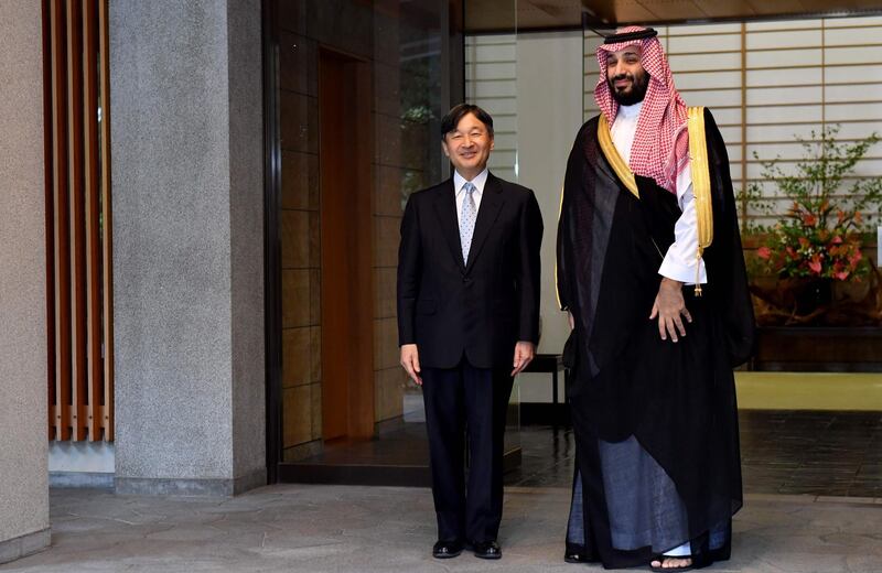 Japan's Emperor Naruhito (L) greets Saudi Arabia's Crown Prince Mohammed bin Salman upon his arrival at the Akasaka Imperial Palace in Tokyo.   AFP