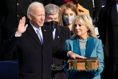 Joe Biden being sworn in as the 46th president of the United States as Jill Biden holds the Biden family Bible during the 59th Presidential Inauguration at the US Capitol in Washington, on January  20, 2021. AP