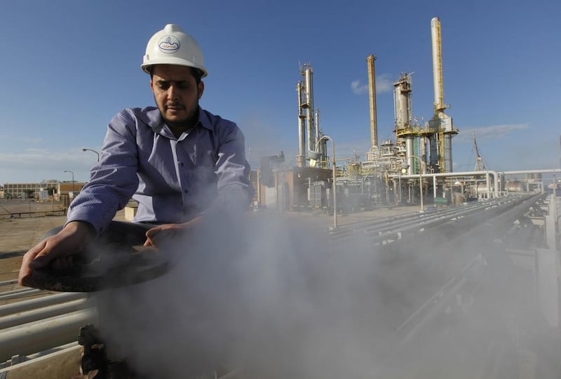 A Libyan oil worker at a refinery in Brega, eastern Libya. Hussein Malla / AP 