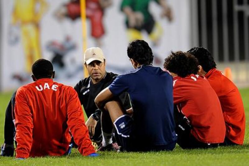 UAE coach Mahdi Ali talks to his players in training.