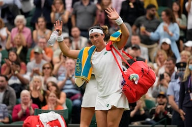 Tunisia's Ons Jabeur waves to the crowd after losing the women's singles quarterfinals match to Aryna Sabalenka of Belarus on day eight of the Wimbledon Tennis Championships in London, Tuesday, July 6, 2021.  (AP Photo / Kirsty Wigglesworth)