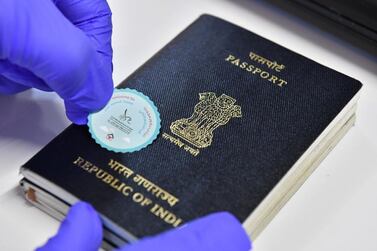 Travellers flying into Dubai International Airport will have welcome back stickers placed on their passports. Courtesy Dubai Media Office / Twitter