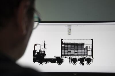 A customs worker inspects an x-ray image of a truck carrying a shipment of sporting goods made in China at the Port of Zeebrugge in Zeebrugge, Belgium, on Monday, May 7, 2018. With Brexit due in 10 months, Zeebrugge embodies the repeated warnings by the U.K.’s EU partners that its departure from the bloc is a lose-lose move by adding bureaucracy for businesses and costs for consumers. Photographer: Jasper Juinen/Bloomberg