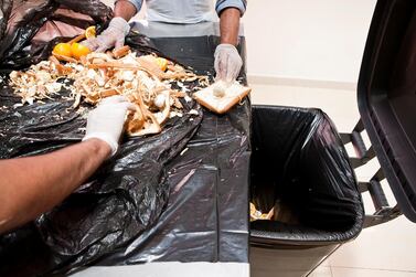 Leftover food is thrown away after a buffet at a hotel. Antonie Robertson / The National