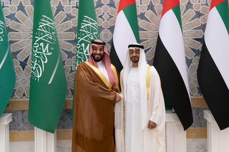 Sheikh Mohamed bin Zayed and Prince Mohamed bin Salman stand for a photograph during a state visit reception.