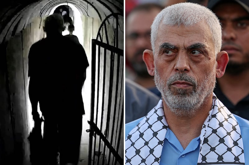 An image grab from a handout video released by the Israeli army shows what they say is Hamas's chief in Gaza, Yahya Sinwar, walking in a tunnel, in the Gaza Strip. AFP