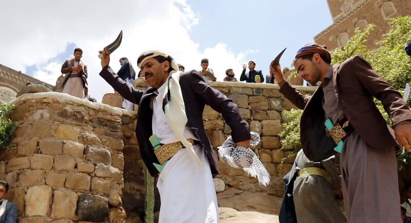 Yemenis perform a traditional dance to celebrate the Eid al-Fitr at a tourist site on the outskirts of Sanaa, Yemen. EPA