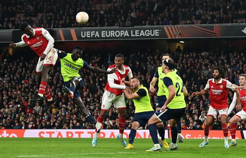 Arsenal attacker Eddie Nketiah heads at goal. AFP