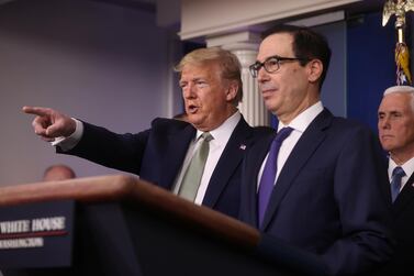 US President Donald Trump takes questions as Treasury Secretary Steven Mnuchin and Vice President Mike Pence look on during the daily coronavirus briefing at the White House in Washington. Reuters