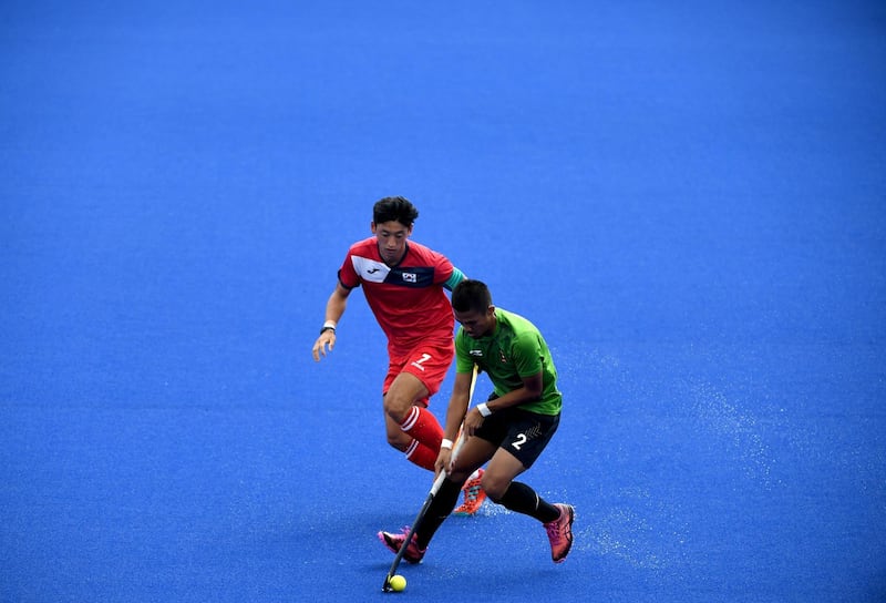 Action from the men's hockey Pool A match between Indonesia and South Korea. Sonny Tumbelaka / AFP