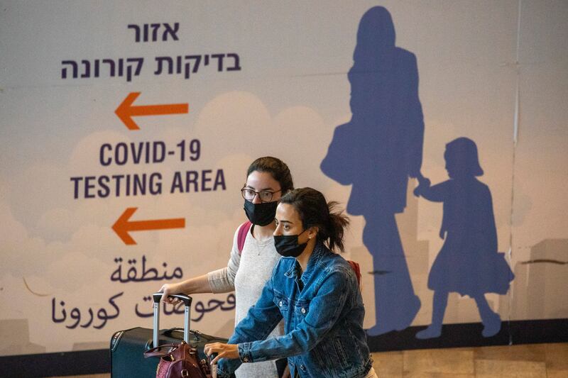 Travellers arrive at Ben Gurion airport near Tel Aviv. AP