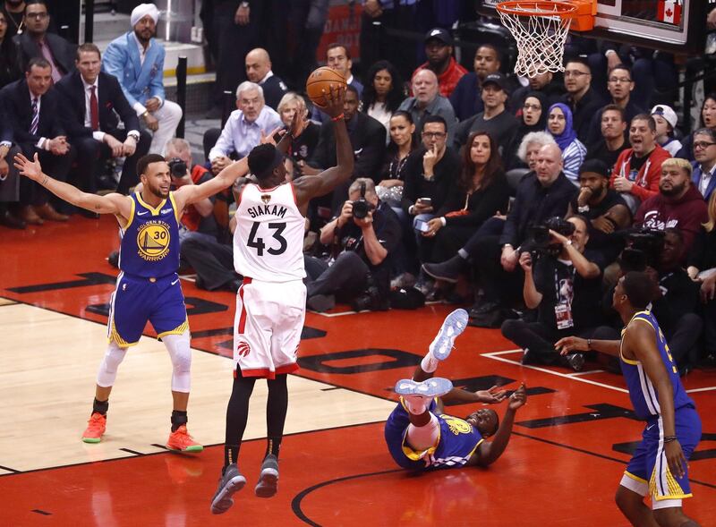 Siakam as Golden State Warriors forward Draymond Green falls to the ground. EPA