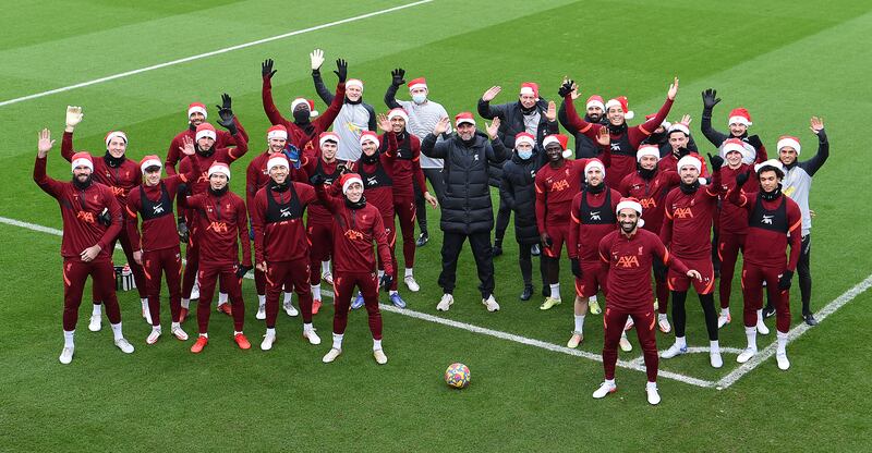 The Liverpool squad wear festive hats at the training session.