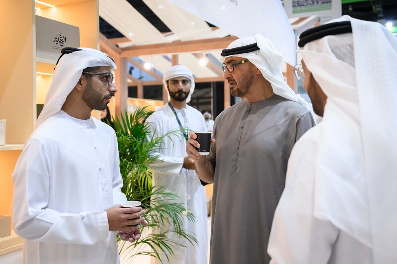 President Sheikh Mohamed speaks with exhibitor Rashed Al Mansoori at Adihex. Abdulla Al Neyadi / UAE Presidential Court
