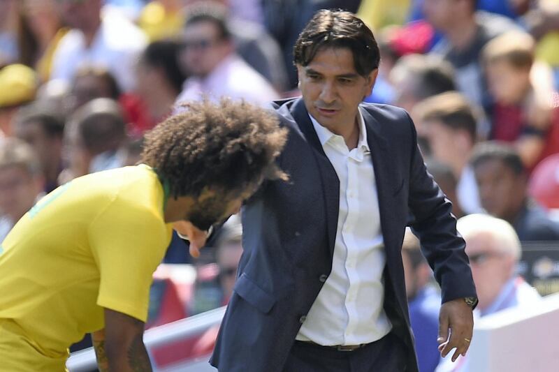 Croatia's manager Zlatko Dalic speaks with Brazil's defender Marcelo during the International friendly football match between Brazil and Croatia at Anfield in Liverpool on June 3, 2018. / AFP PHOTO / Oli SCARFF
