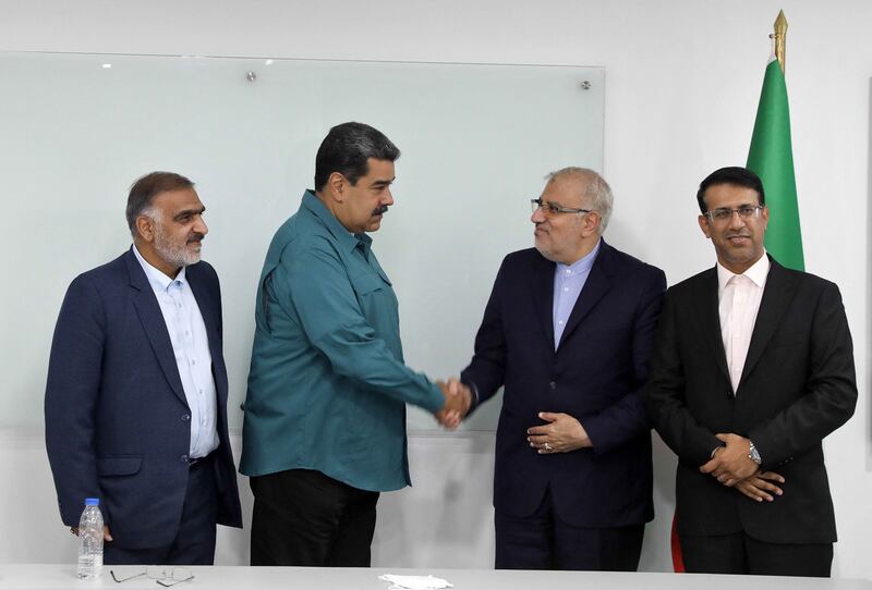 Venezuela's President Nicolas Maduro, second left, shakes hands with Iran's Oil Minister Javad Owji during his visit to Caracas earlier this month. Photo: AFP