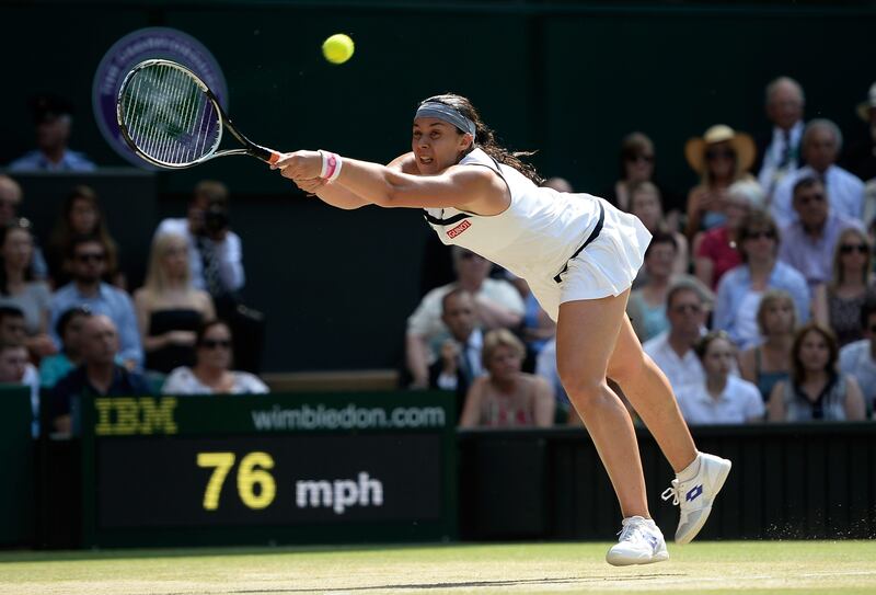 LONDON, ENGLAND - JULY 06:  Marion Bartoli of France plays a forehand during the Ladies' Singles final match against Sabine Lisicki of Germany on day twelve of the Wimbledon Lawn Tennis Championships at the All England Lawn Tennis and Croquet Club on July 6, 2013 in London, England.  (Photo by Dennis Grombkowski/Getty Images) *** Local Caption ***  173068803.jpg