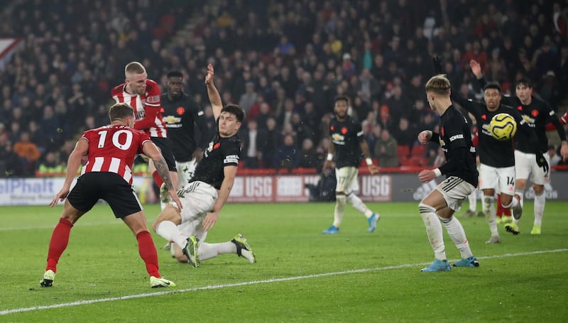 Sheffield United's Oliver McBurnie scores their third goal. Reuters