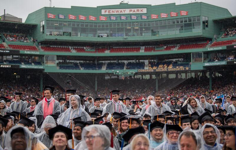 Graduates stand during the conferring of degrees as part of commencement ceremonies for Northeastern University at Fenway Park in Boston, Massachusetts. EPA